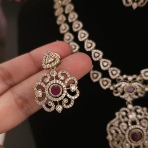 Moissanite stone necklace set with Red centre stone.