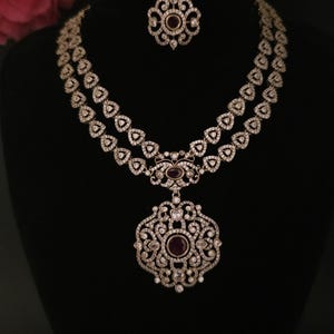 Moissanite stone necklace set with Red centre stone.