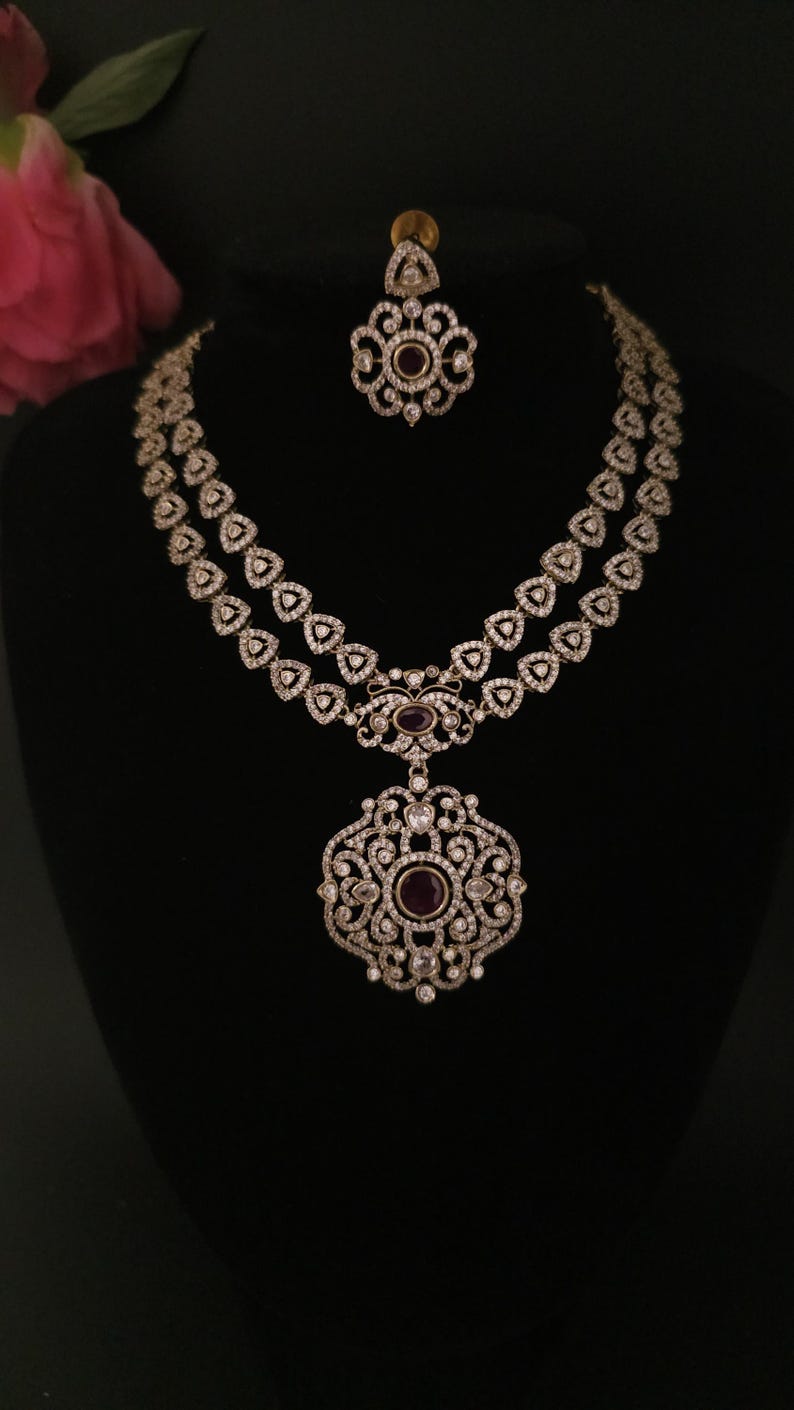 Moissanite stone necklace set with Red centre stone.