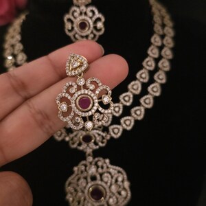 Moissanite stone necklace set with Red centre stone.