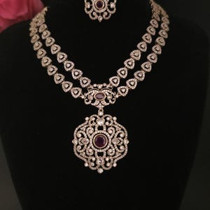 Moissanite stone necklace set with Red centre stone.