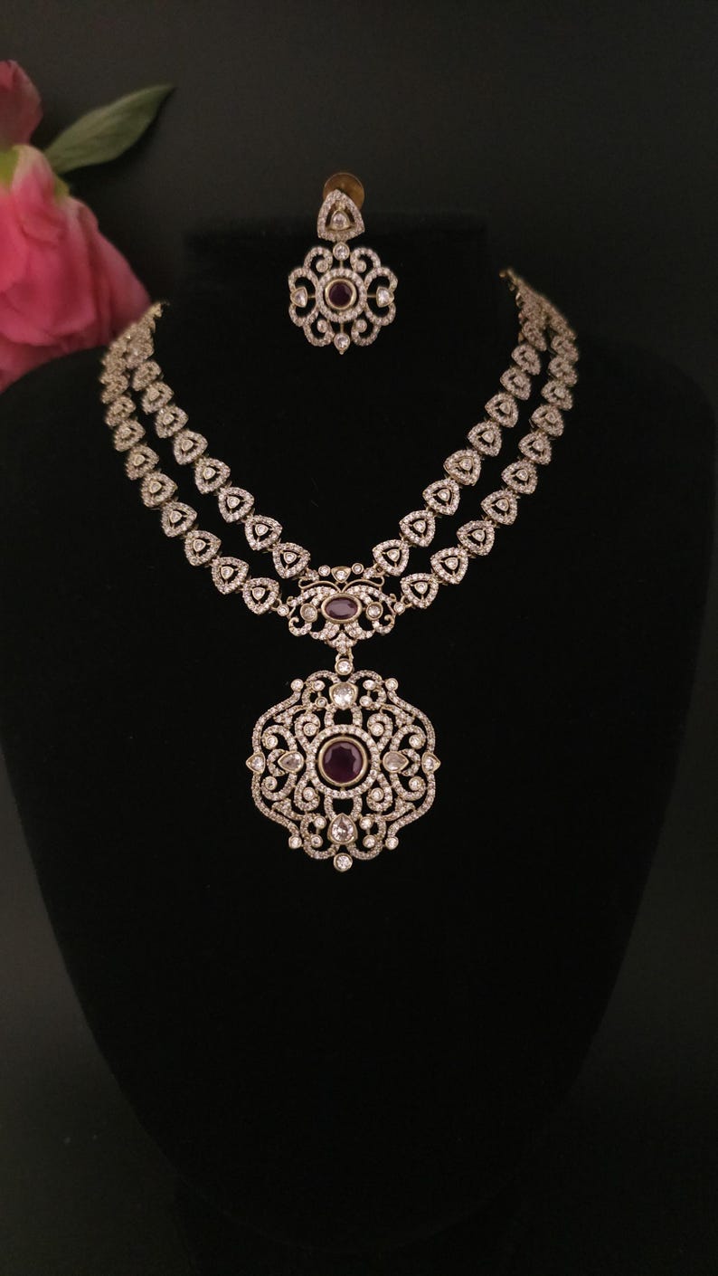 Moissanite stone necklace set with Red centre stone.
