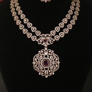Moissanite stone necklace set with Red centre stone.