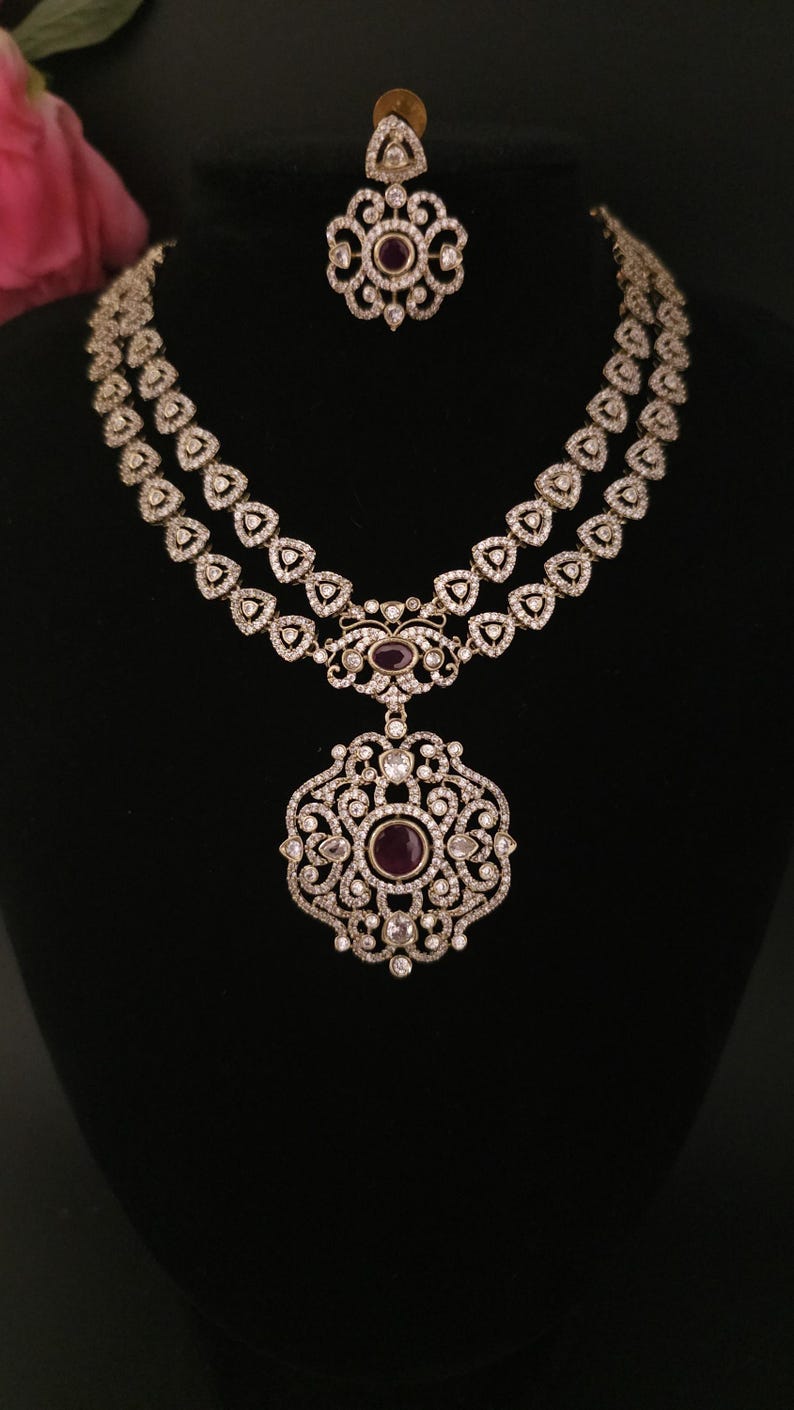 Moissanite stone necklace set with Red centre stone.
