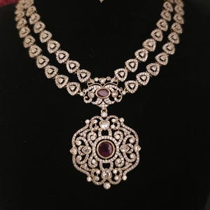 Moissanite stone necklace set with Red centre stone.