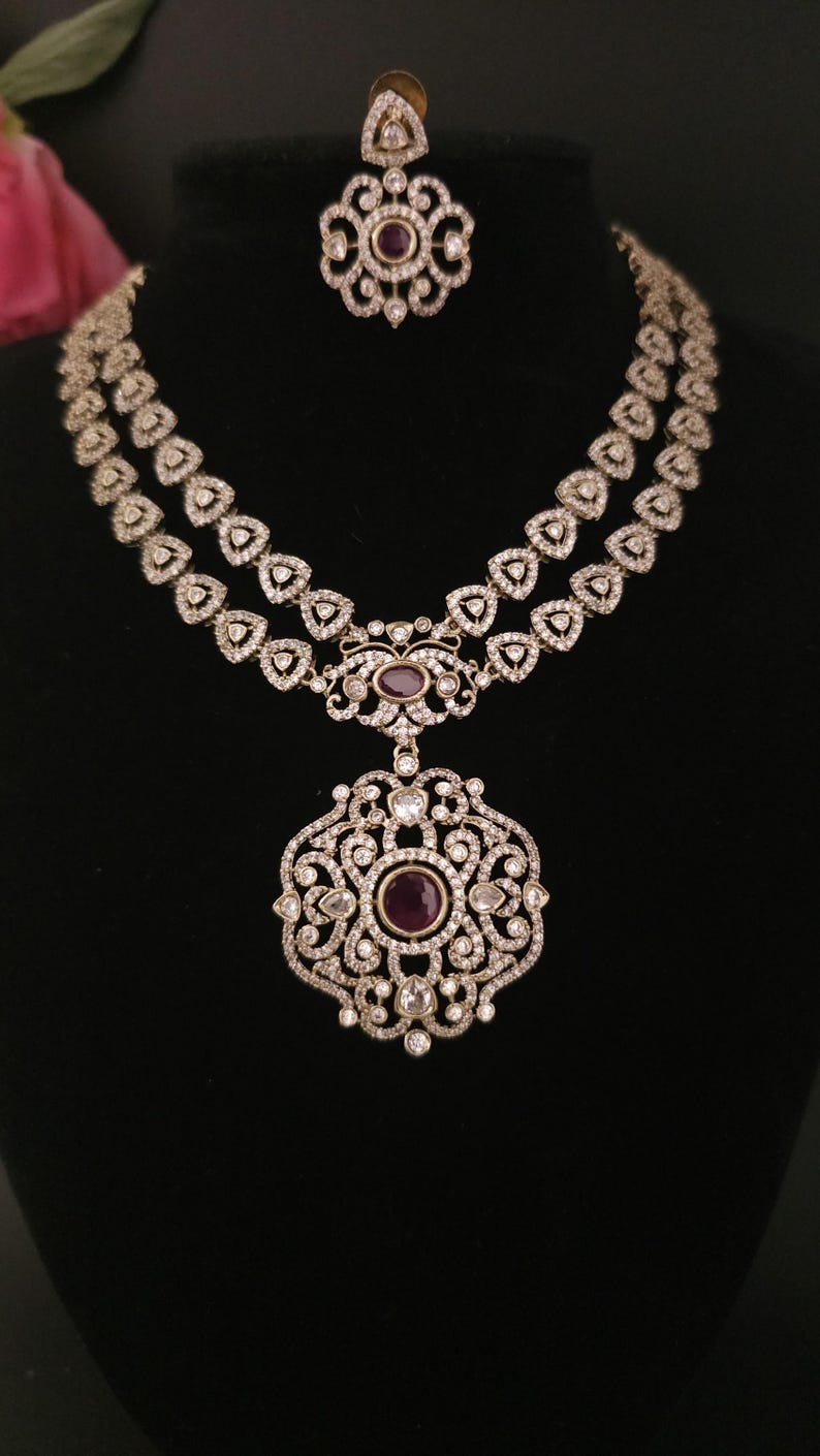 Moissanite stone necklace set with Red centre stone.