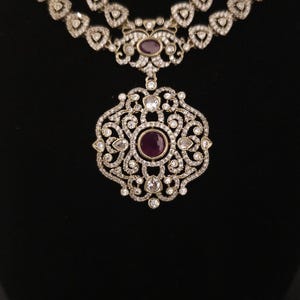 Moissanite stone necklace set with Red centre stone.