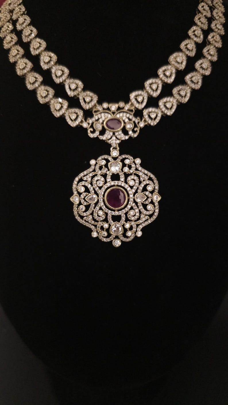 Moissanite stone necklace set with Red centre stone.