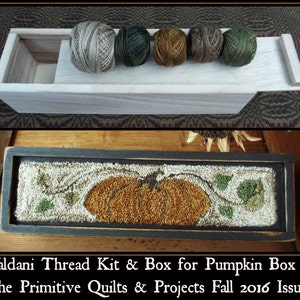 May include: A wooden box with a lid, containing a thread kit for a pumpkin box craft project. The kit includes five spools of embroidery floss in shades of brown, green, and beige. The box is labeled "Valdani Thread Kit & Box for Pumpkin Box in the Primitive Quilts & Projects Fall 2016 Issue."