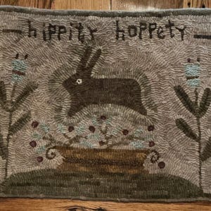 May include: A rustic wooden sign with the text "Welcome to our home" in white lettering. The sign features a distressed finish and a simple, inviting design, perfect for entryway decor.