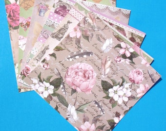 May include: A stack of patterned paper sheets with floral designs and handwritten text. The text includes phrases like "pretty summer", "flowers", "fashion", and "collection".