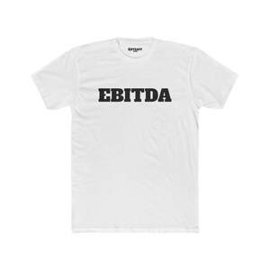 May include: White t-shirt with the word "EBITDA" printed in black on the front.