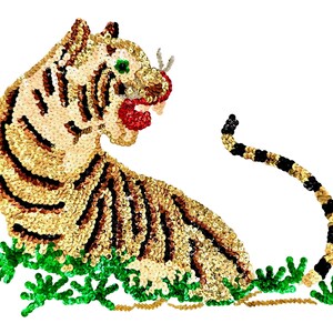May include: A tiger-shaped patch crafted from gold, black, and white sequins. The tiger is depicted in a seated position with its head turned, featuring a red sequined mouth, a green eye, and a long tail. Bright green sequined foliage is at the base.
