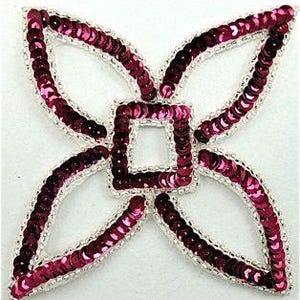 May include: A four-petaled flower-shaped applique patch featuring deep magenta sequins arranged in a repeating pattern. The edges of each petal and the central square are outlined with a thin, shimmering silver metallic thread border.
