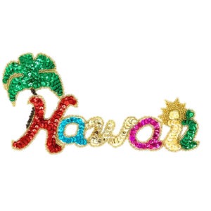 May include: A colorful sequined Hawaii brooch. The word "Hawaii" is spelled out in red, blue, gold, and pink sequins, with a green palm tree and a sun design. The brooch is outlined in gold.