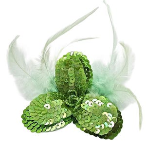 May include: A decorative floral appliqué featuring three rounded petals densely covered in shimmering lime green sequins. The centre is accented with small green beads, and the entire piece is framed by delicate, wispy light green feathers.