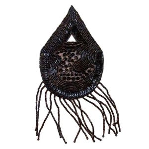 May include: A black beaded teardrop-shaped accessory with a circular design and dangling fringe. The accessory is made of small, dark beads and sequins, creating a textured surface. The fringe hangs from the bottom, adding movement.