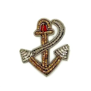 May include: Embroidered anchor patch with gold, silver, and red accents. The nautical-themed patch features intricate beadwork and a detailed design. The anchor is a classic symbol of maritime culture.