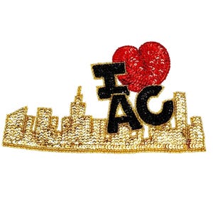 May include: A gold sequined cityscape patch with the text "I ❤️ AC" in black letters and a red sequined heart. The patch features a detailed skyline design, perfect for adding to clothing or accessories.