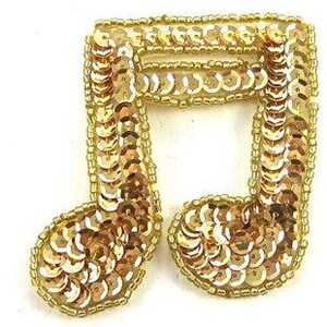 May include: Gold sequined music note applique. This decorative embellishment is perfect for adding a touch of sparkle to crafts, clothing, and accessories.