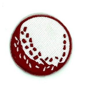 May include: A circular embroidered patch featuring a white golf ball design with a textured surface. The ball is partially overlaid by a deep red section that covers the lower left portion, creating a distinct contrast between the white and red.
