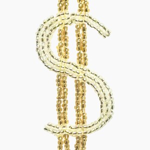May include: A beaded dollar sign in gold and clear beads against a white background. The symbol is made of small, round beads strung together to form the iconic currency symbol. The beads have a shiny finish.