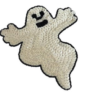 May include: A white sequined ghost-shaped patch with a black beaded outline. The ghost has black eyes and mouth. This decorative patch is perfect for Halloween-themed crafts and apparel.