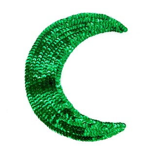 May include: A crescent-shaped patch, densely covered in bright green sequins, against a white background. The sequins catch the light, creating a shimmering effect. This decorative patch is suitable for embellishing clothing or accessories.