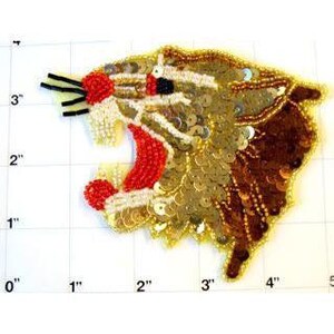 May include: A gold, brown, and red sequined iron-on patch of a roaring tiger head. The tiger's mouth is open and its teeth are visible. The patch is approximately 3 inches wide and 4 inches tall.