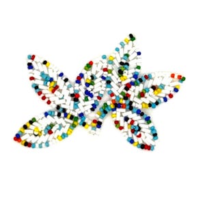 May include: A decorative applique shaped like a cluster of leaves, crafted from white tube beads and small round beads in vibrant colors including red, blue, yellow, green, and black, arranged in a dense, textured pattern on a white background.
