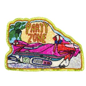 May include: A beaded patch with the words "PARTY ZONE" in gold letters. The patch features a pink car, a palm tree, and a red and blue design. The patch is outlined in green and yellow beads.