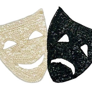 May include: Two theatrical masks, one smiling and one frowning, side by side. The masks are covered in sequins. The smiling mask is off-white, and the frowning mask is black. The masks are a symbol of comedy and tragedy.