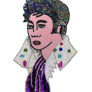 May include: A beaded patch featuring a stylized portrait of a person with dark hair, wearing a white collared shirt adorned with iridescent sequins and colorful faceted gems, and a deep purple sequined scarf draped around the neck.