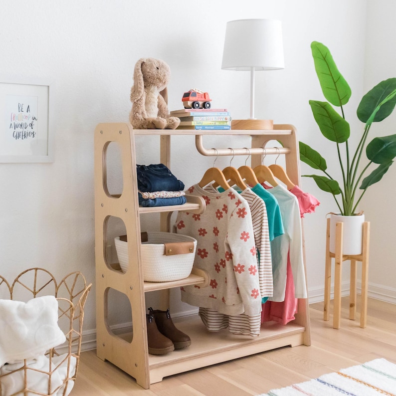 Montessori style Wardrobe for toddlers. Designed with four shelves and a curved rod for hanging clothes.