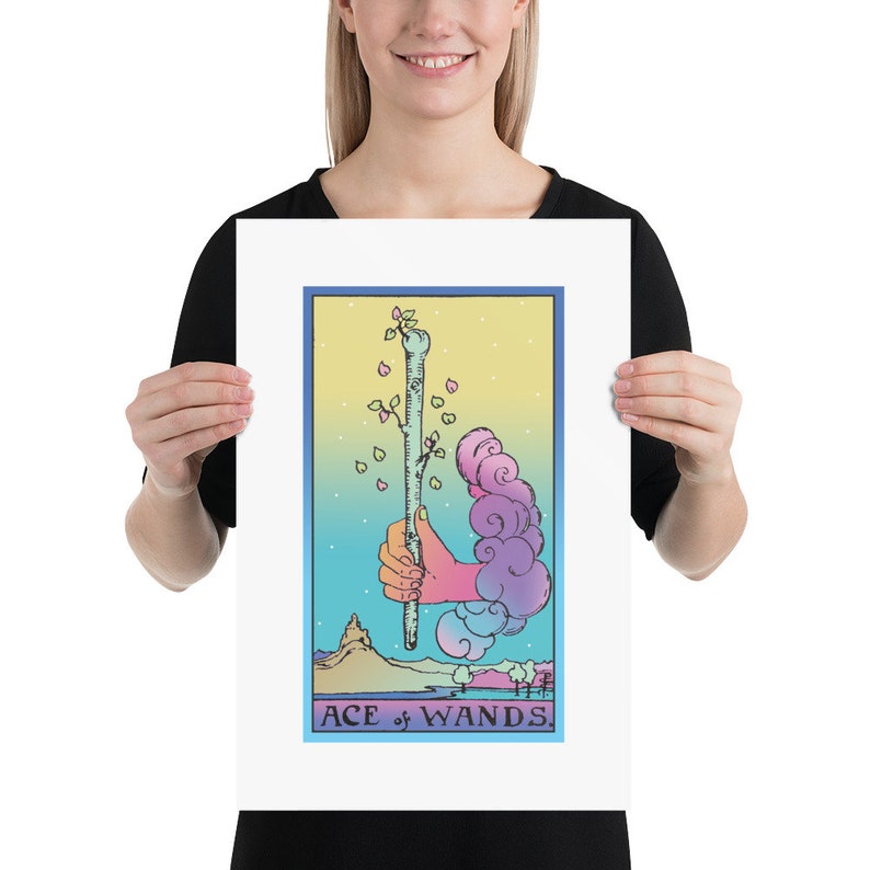 May include: A pastel-colored tarot card illustration of the Ace of Wands. The card features a hand holding a wand with a small plant growing from the top. The background is a gradient of blue, yellow, and pink.