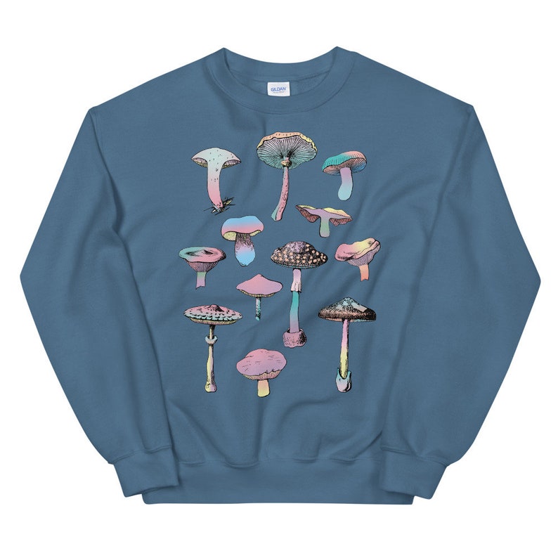 May include: A blue sweatshirt with a colorful mushroom graphic print. The mushrooms are in various shapes and sizes, with pink, blue, green, and yellow accents.