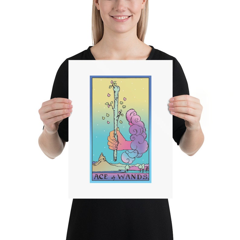 May include: A tarot card illustration of the Ace of Wands. The card features a hand holding a wand with a small tree growing from the top. The background is a gradient of blue, yellow, and pink with clouds and stars.