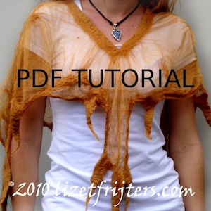 May include: A woman is wearing a sheer, burnt orange shawl with a frayed edge. The shawl is draped over her shoulders and hangs down to her waist. The text "PDF TUTORIAL" is printed in black on the shawl. The text "© 2010 lizetfrijters.com" is printed in black at the bottom of the shawl.