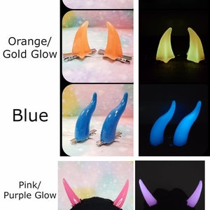 May include: A collection of colorful, horn-shaped hair clips in green, orange, blue, pink, and aqua. Some horns glow in the dark. The image includes text labels for each color.
