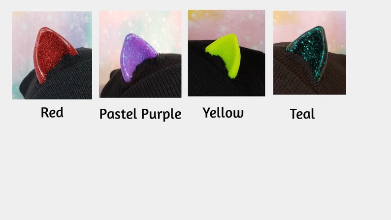 May include: Four close-up images of cat ears in red, pastel purple, yellow, and teal. Each ear is attached to a black beanie. The red and teal ears have glitter. The text below each image indicates the color.