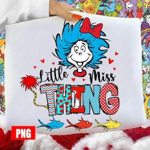 May include: White graphic tee featuring the character "Thing" from Dr. Seuss's books. The design includes the text "Little Miss Thing" with a blue-haired character, red hearts, and colorful fish illustrations.