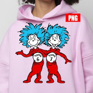 May include: A light pink hoodie featuring a graphic of Thing 1 and Thing 2 from Dr. Seuss's "The Cat in the Hat." The characters are in red outfits with white circles that say "Thing 6" and "Thing 7." They have blue, spiky hair and white faces.