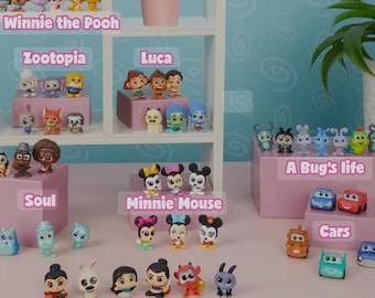 May include: A collection of small, colorful figurines from Disney movies, including Winnie the Pooh, Zootopia, Luca, Soul, Minnie Mouse, A Bug's Life, Cars, and Mulan. The figurines are arranged on shelves and a table.