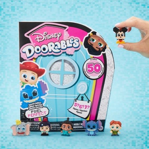 May include: A Disney Doorables Pixel Perfect special edition box set with various character figurines. The box features the Doorables logo and the text "50 to collect". The set includes pixelated figures of Disney characters, including Mickey Mouse.