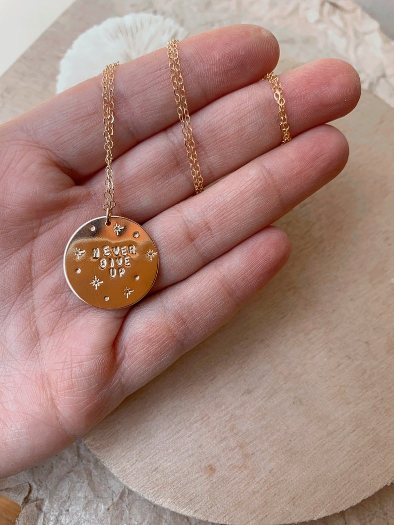 Never Give Up big gold filled disc necklace graduation encourage encouragement strength under fire woman power together