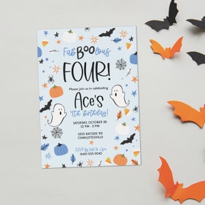 May include: A light blue Halloween-themed birthday invitation with the words "Fab-BOO-lous FOUR!" and "Ace's 4th Birthday!" in black and blue. The invitation is decorated with pumpkins, ghosts, bats, spiders, and stars. Orange and black paper bats are scattered around the invitation.