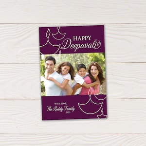 May include: A greeting card with a family photo, featuring a purple background with white line art of oil lamps. The words "HAPPY Deepavali" are at the top, and "WITH LOVE, The Reddy Family 2023" at the bottom.