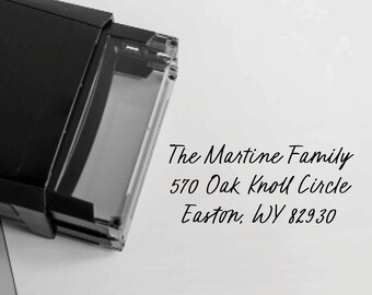 May include: A black rectangular address stamp with a clear window. The text "The Martine Family, 570 Oak Knoll Circle, Easton, WY 82930" is printed in black cursive font.