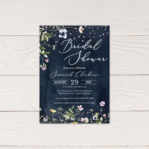 May include: A navy blue bridal shower invitation with a floral design and gold lettering. The invitation reads "Bridal Shower" and "Join us to celebrate Javannah Claiborne August 29, 2021 at 2 o'clock in the afternoon Hurst Planetarium at Ella Sharp Museum 3225 Fourth Street - Jackson Michigan RSVP by August 20 to Anna at 517-555-5585 Savannah is registered at Pottery Barn and Target"