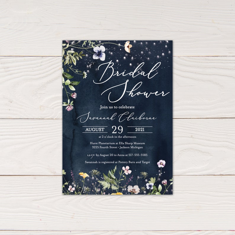 May include: A navy blue bridal shower invitation with a floral design and gold lettering. The invitation reads "Bridal Shower" and "Join us to celebrate Javannah Claiborne August 29, 2021 at 2 o'clock in the afternoon Hurst Planetarium at Ella Sharp Museum 3225 Fourth Street - Jackson Michigan RSVP by August 20 to Anna at 517-555-5585 Savannah is registered at Pottery Barn and Target"